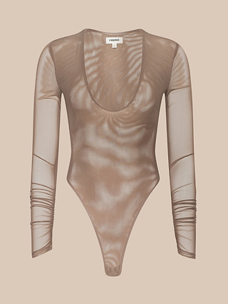 The Thalassa High-Leg Bodysuit is a sheer, long-sleeve brown mesh piece featuring a scoop neckline, high-cut legs, and ruched sleeves, offering a modern twist on the classic sexy bodysuit silhouette and displayed on a plain beige background.
