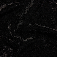 Close-up of a black Thalassa Velvet Mesh Bodysuit with a shimmering velvet and mesh texture.