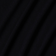 Close-up of black stretch jersey fabric with soft, diagonal folds creating gentle shadows and texture, highlighting the smooth and slightly matte surface characteristic of the Riza Boatneck Bodysuit.