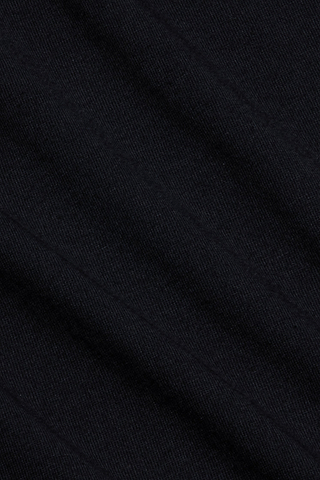 Close-up of black Supima cotton fabric with a subtle diagonal pattern and visible texture, showcasing fine threads and soft folds—ideal for the comfortable fit of the Aileen Cotton Crewneck Tee.