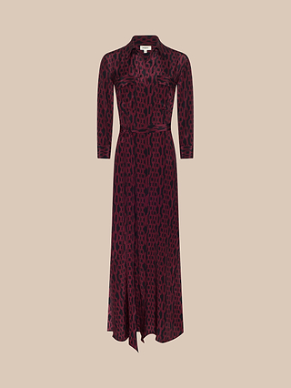 Introducing the Cameron Silk Shirt Dress, a long-sleeved, collared maxi dress crafted from luxurious silk in rich deep maroon. Featuring an all-over black geometric chain pattern, button-down front, two chest pockets, and a matching fabric belt, this shirtdress is displayed against a neutral beige background.