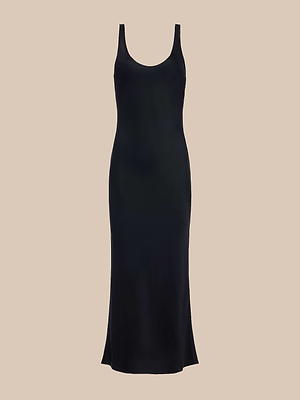 The Akiya Satin Maxi Dress is a sleeveless, ankle-length black tank dress with a scoop neckline and a simple, fitted silhouette, shown on a plain beige background.