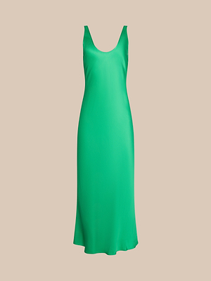 The Akiya Satin Maxi Dress is a sleeveless, bias-cut slip in vibrant island green with a scoop neckline, shown on a plain beige background.