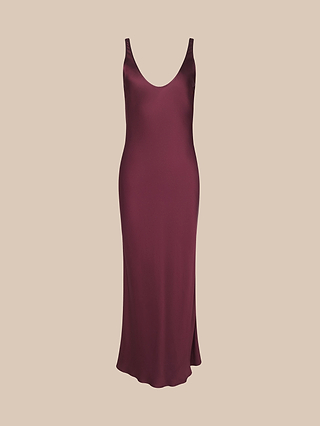 The Akiya Satin Maxi Dress is a sleeveless, floor-length burgundy gown featuring a deep scoop neckline, displayed against a simple beige background.