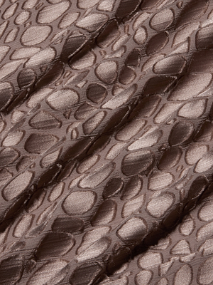 Close-up of the Christine Burnout Satin Dress shows its shiny brown cobra-print fabric with abstract, irregular ovals in a raised satin texture that catches the light.