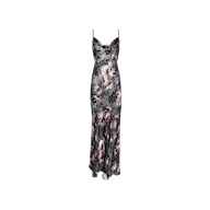 The Christine Dress is a sleeveless, floor-length slip dress with thin straps, crafted from burnout satin and featuring a grey, pink, and black rose print on a white background.