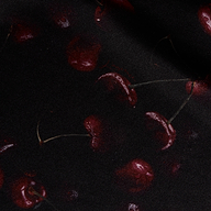 Seridie Silk Slip Dress in dark fabric patterned with scattered, deep red cherries.