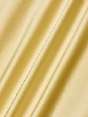 The Seridie Silk Slip Dress features smooth, golden-yellow bias-cut silk with gentle folds and diagonal lines that reflect light, creating a soft, elegant texture—perfect for a chic slip dress look.