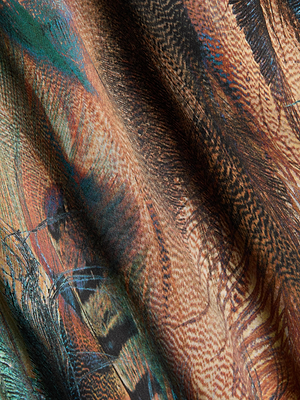 Close-up of the Seridie Silk Slip Dress by L'AGENCE, featuring a vibrant teal feather print in shades of brown, orange, black, and teal—perfect for a bias-cut style that mimics overlapping feathers.