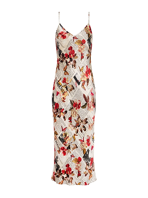 The Seridie Silk Slip Dress is a sleeveless, spaghetti strap slip dress with a fitted silhouette and a collage-style newspaper print of red flowers and clippings on white silk.