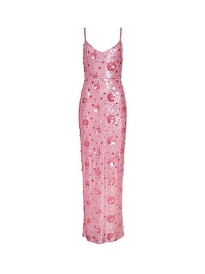 The Karma Sequin Maxi Dress is a sleeveless, floor-length pink dress with thin straps and a fitted silhouette, featuring a floral sequin pattern, shown against a white background.