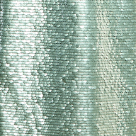 Close-up of shimmering silver-green sequins arranged in overlapping rows on the Karma Sequin Maxi Dress, creating a reflective, wavy texture with light highlights and subtle shadows reminiscent of a fitted evening gown.
