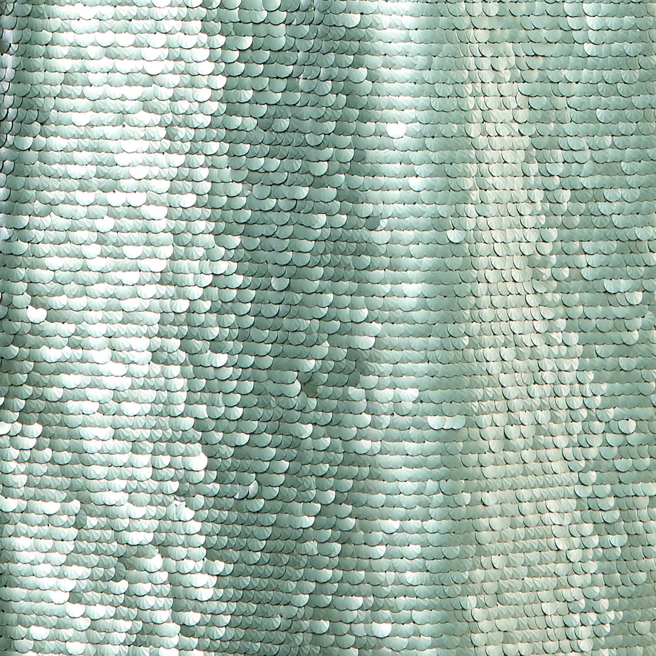 Close-up of shimmering silver-green sequins arranged in overlapping rows on the Karma Sequin Maxi Dress, creating a reflective, wavy texture with light highlights and subtle shadows reminiscent of a fitted evening gown.
