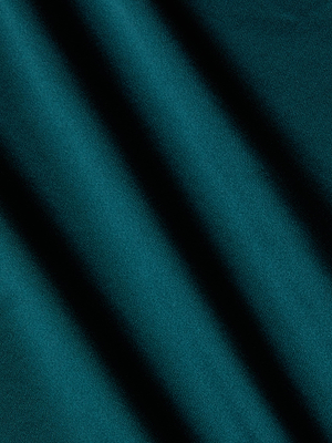 L'AGENCE's Charmaine Silk Gown showcases teal velvet fabric with soft diagonal lines, capturing the textured elegance and refined grace of a classic bias-cut silk gown.