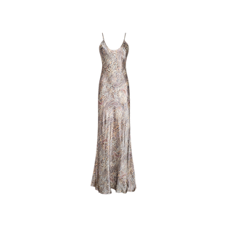 The Charmaine Silk Gown is a long, sleeveless slip dress with adjustable straps and a fitted bodice, adorned with a swirling abstract pattern in neutral tones on a light background. Elegantly crafted from silk and cut on the bias for a flattering, graceful drape.