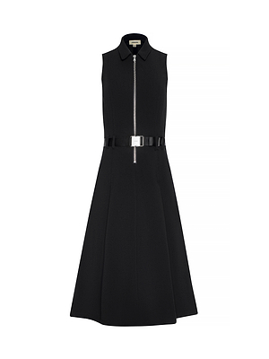 The Kylo Shirt Dress is a sleeveless black structured suit dress featuring a collar, front zipper, fitted waist with belted buckle, flared skirt, minimalist design, and convenient pockets for chic style and functionality.