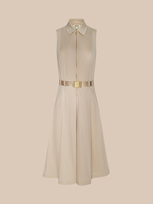 The Kylo Poplin Shirt Dress is a sleeveless beige organic cotton dress with a front zipper and metallic gold waist belt, perfect for stylish desk-to-drinks looks. Shown against a plain light background.