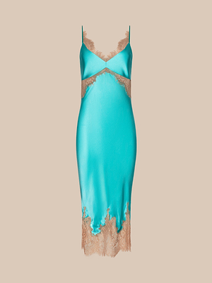 The Scotly Silk Lace Dress, shown on a beige background, features turquoise silk charmeuse cut on the bias for an elegant drape. It has thin straps and nude lace trim along the neckline, underbust, and hem.