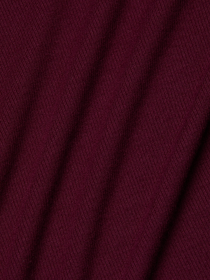 Close-up of the maroon, ribbed fabric on the Voletta Turtleneck Midi Dress by L'AGENCE, showing diagonal folds that create a textured, wavy look reminiscent of subtle 90s style.