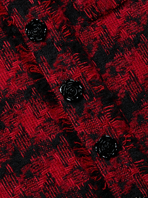 Close-up of a red and black Italian houndstooth tweed with three black rose-shaped buttons on the Aya Tweed Midi Dress by L’AGENCE—an elegant Fall 25 NYFW detail.