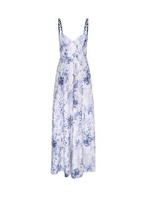 The Sutton Beaded Strap Gown is a sleeveless, long white spring-summer dress with blue floral patterns, a fitted bodice, flared skirt, and beaded straps, shown on a white background.