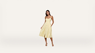 Woman wearing a sleeveless yellow midi dress with buttons down the front, standing and facing forward against a plain white background.
