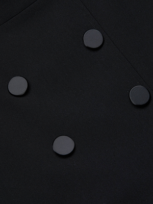 Close-up of the L'AGENCE Catherine Tuxedo Midi Dress, a black midi dress with five round flat buttons in a staggered double-breasted style and refined tailored suiting details.