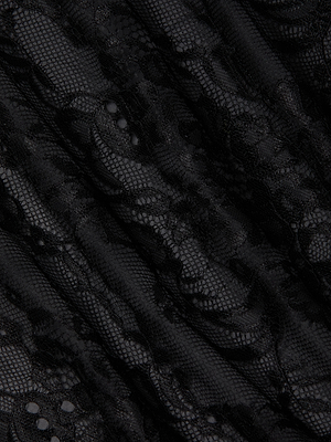 Close-up of the Henrietta Lace Mini Dress by L'AGENCE, featuring black floral lace with scalloped edges, intricate floral patterns, mesh accents, and gently wavy folds.