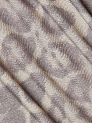 Close-up of soft, ribbed fabric in beige and light brown with an abstract print, draped in gentle folds—perfect for the Paityn Shirred Dress, offering a stretch jersey with a flattering fit.