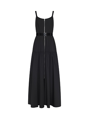 The Rima Maxi Dress is a sleeveless black stretch poplin dress featuring thin straps, a front zipper, belted waist, and flared tiered skirt. This chic silhouette is shown on a white background.