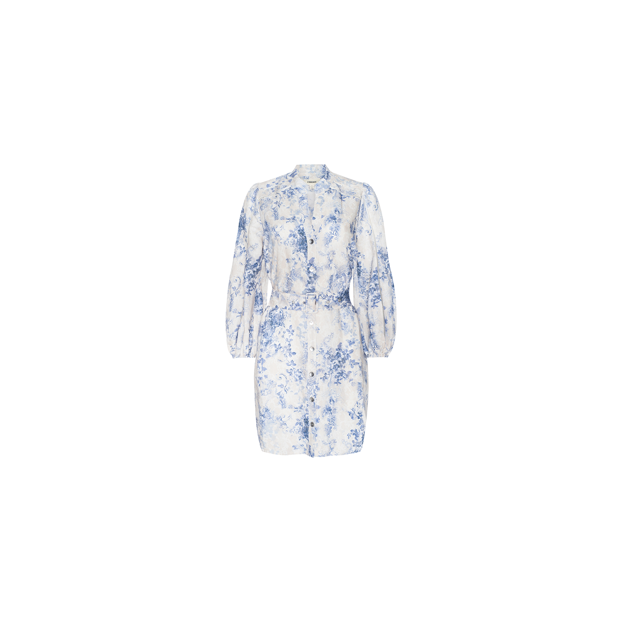 The Kiersten Dress is a white mini dress in a linen blend featuring long blouson sleeves, a standout blue floral toile print, button-up front, and belted waist, displayed against a plain white background.