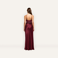 Back view of the Elsa Silk Gown, a floor-length burgundy silk slip dress with thin straps and black lace accents at the bodice.