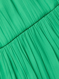 Close-up of the gathered green crinkle-effect satin fabric on the Lua Tiered Maxi Dress, featuring a horizontal seam that highlights its pleats and textured look.