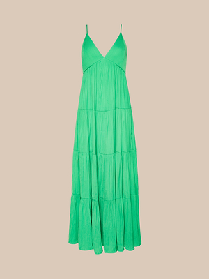 The Lua Tiered Maxi Dress is a sleeveless, bright green maxi dress in crinkle-effect satin with adjustable spaghetti straps and a flowing tiered skirt, shown against a plain beige background.