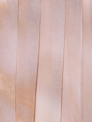 Close-up of light pink satin fabric with vertical, slightly darker stripes, reminiscent of the soft, smooth texture featured in the Raine Strapless Gown’s pleated dress with a built-in corset.