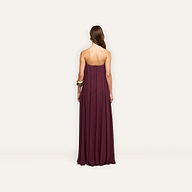 Back view of a floor-length, plum-colored Raine Strapless Gown in viscose chiffon, featuring a strapless design with a relaxed fit and a built-in corset.