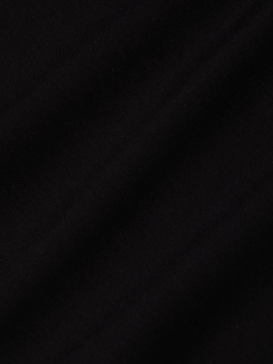 A close-up of the Eira Midi Dress in super stretch ponte black fabric, featuring subtle diagonal folds and a soft, matte texture.