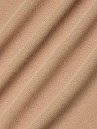 Close-up of beige poly georgette fabric with soft, diagonal waves and shadows, highlighting its smooth texture and gentle folds—an ideal choice for the Raye Slip Lining Dress featuring adjustable straps.