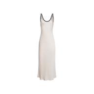 Introducing the Akiya Satin Maxi Dress: a sleeveless, ankle-length vintage white gown crafted in a flattering bias-cut satin design. It features a scoop neckline and is elegantly detailed with black trim along the straps and neckline, beautifully displayed against a plain white backdrop.