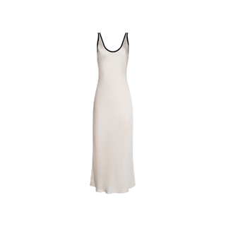 Introducing the Akiya Satin Maxi Dress: a sleeveless, ankle-length vintage white gown crafted in a flattering bias-cut satin design. It features a scoop neckline and is elegantly detailed with black trim along the straps and neckline, beautifully displayed against a plain white backdrop.
