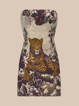The Renee Tapestry Mini Dress is a strapless mini dress showcasing an Italian custom jacquard tapestry design with a lounging leopard surrounded by flowers and foliage on a beige background.