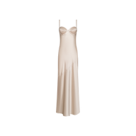 The Sayla Silk Gown, crafted in a cream-champagne satin with delicate spaghetti straps and a structured bust, features a long, flowing silhouette that exudes vintage glamour, beautifully presented against a plain white background.