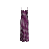 The Sayla Silk Gown is a sleeveless, purple satin dress adorned with white polka dots, featuring thin straps and a fitted bodice, displayed on a plain white background.