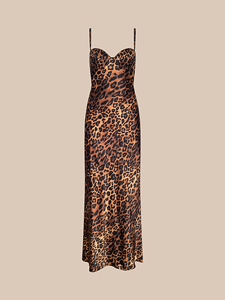 The Sayla Silk Gown is a sleeveless, ankle-length gown crafted from silk, featuring thin straps and a fitted bodice with underwire cups. It showcases a striking brown and black leopard print on a beige background.