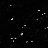 Close-up of black fabric on the Sayla Sequin Gown, covered with shiny black sequins reflecting small spots of light, creating a textured and sparkling effect reminiscent of vintage glamour.