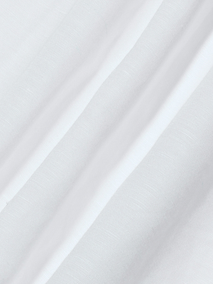Close-up of the Didi Maxi Dresss white linen blend fabric, showcasing subtle diagonal folds and a fine, slightly textured weave pattern across the surface.