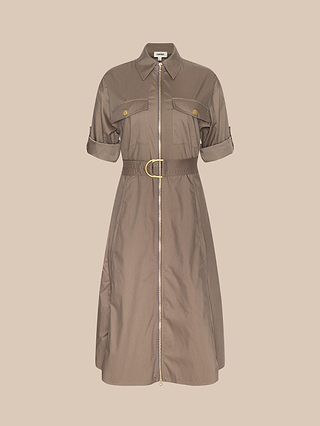 The Callen Shirt Dress, made from cotton-blend poplin, showcases short rolled-up sleeves, an exposed front zip, buttoned chest pockets, and a belted waist with a gold buckle, presented against a plain beige background.
