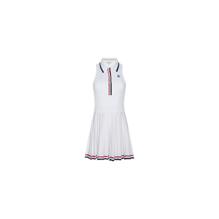 The Winny Polo Tennis Dress is a sleeveless white tennis dress with a pleated skirt and a flattering drop-waist silhouette. It features navy and red trim on the collar, button placket, and hem, along with a small logo on the left chest. The dress is shown against a plain white background.