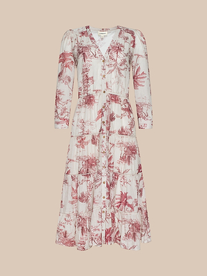 The Serafine Midi Dress is a long-sleeved, V-neck, button-down summer midi with a white base and red botanical toile print, shown on a plain beige background.
