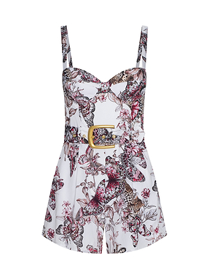 The Tammy Romper is a sleeveless, vibrant piece with thin straps, a sweetheart neckline, structured bodice, floral and animal print in pink, black, and purple hues, and a wide belt featuring a large square buckle at the waist.